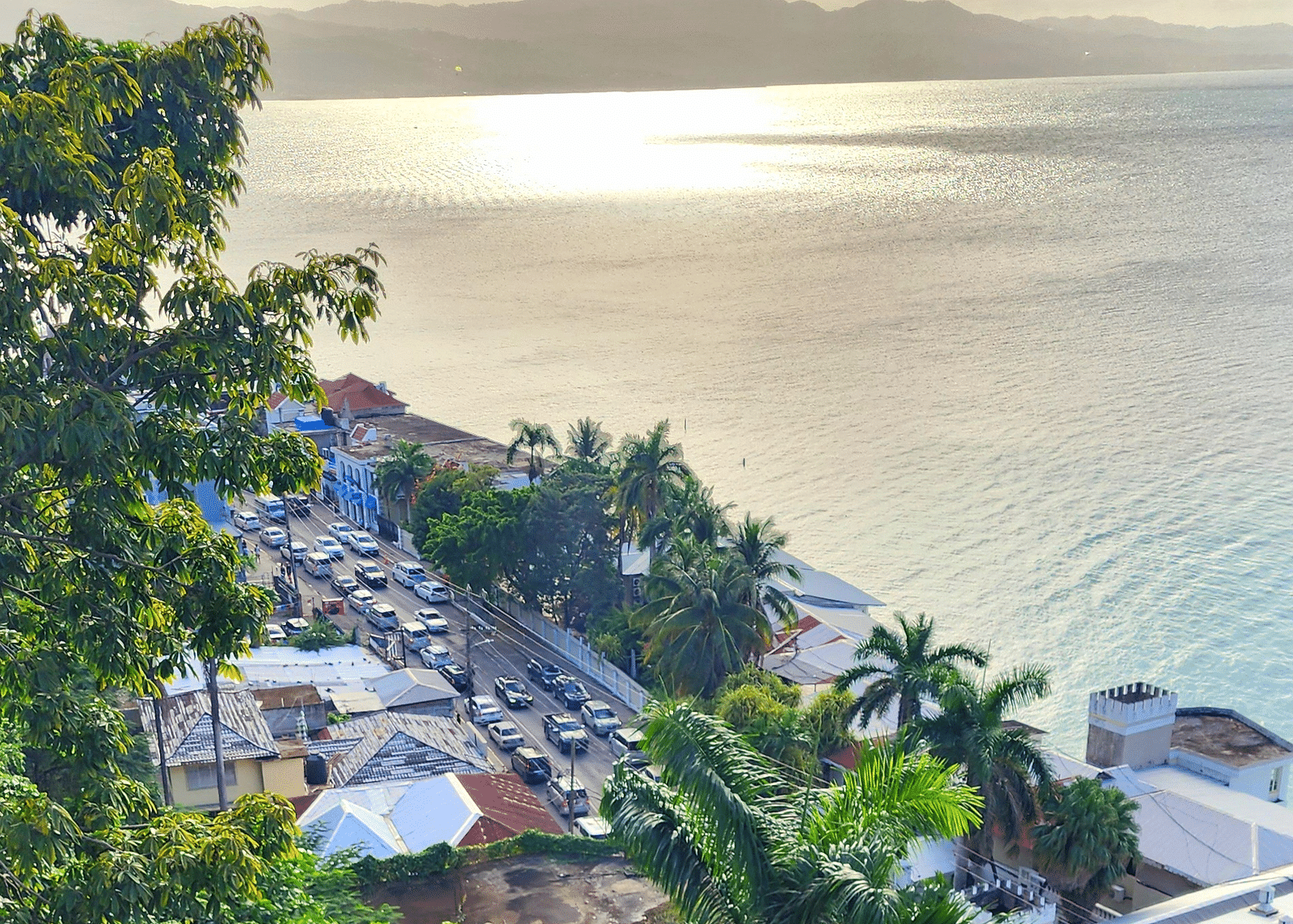 Image of Hip Strip  with sea on the right and a bustling road on the left